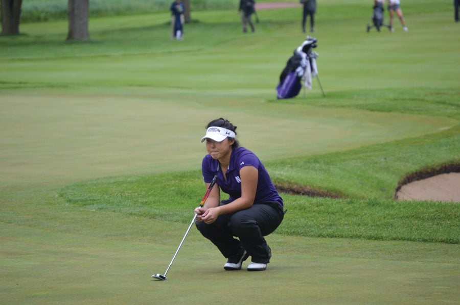 Sarah Cho examines a putt during the 2017 NCAA Championships at Rich Harvest Farms.