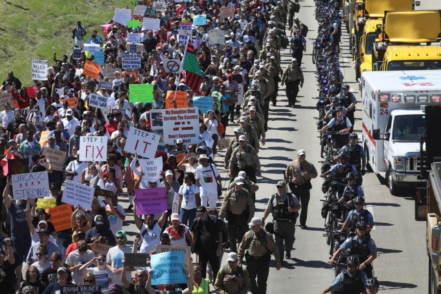 Protesters walk north on the Dan Ryan Expressway after blocking transportation in an anti-violence march. In addition to protesters from Chicago, at least 36 Evanston residents joined the shutdown in solidarity.