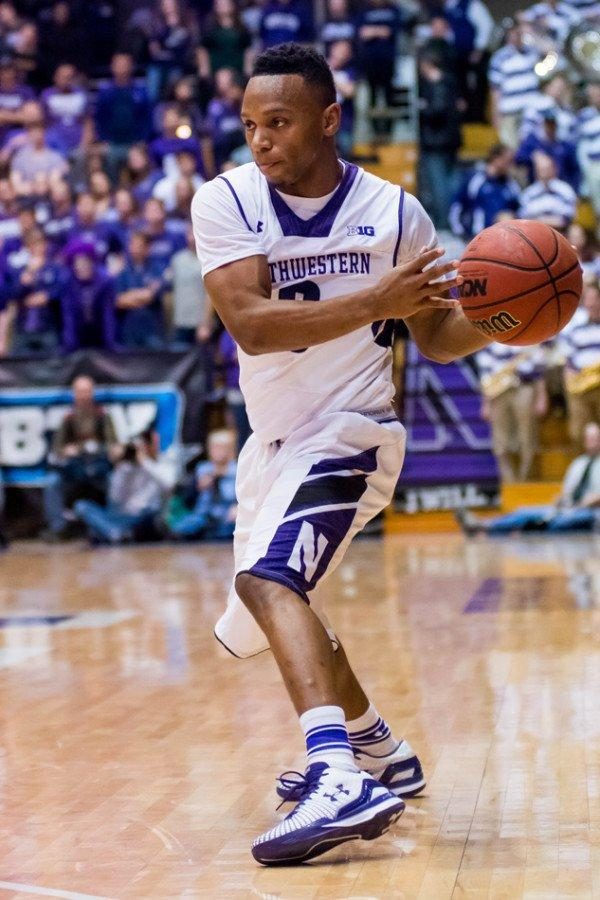 Johnnie Vassar makes a pass while playing for Northwestern basketball in 2014-15. Vassar announced his graduate transfer to Tennessee Tech earlier this summer.