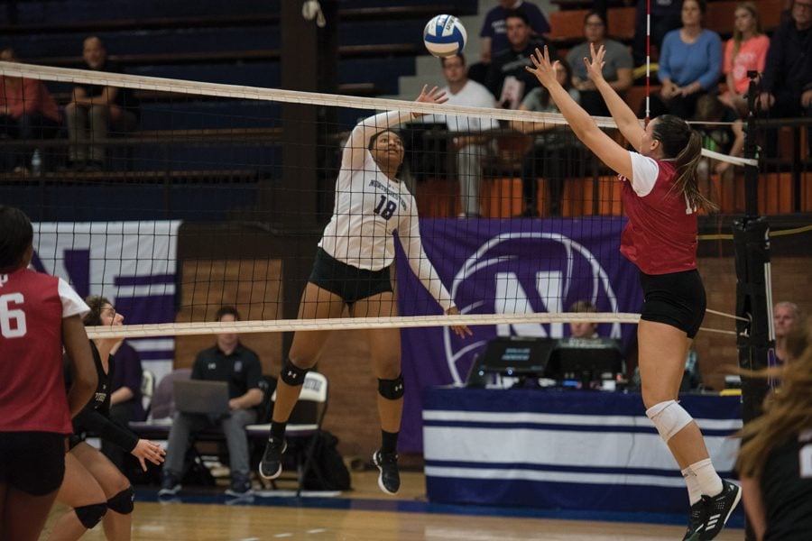 (Daily file photo by Katie Pach) Nia Robinson attacks a ball. The sophomore outside hitter had double-digit kills in all three games of the tournament.