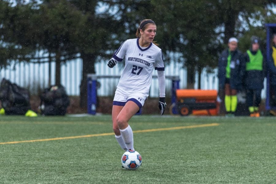 (Daily file photo by David Lee) Kayla Sharples surveys the pitch. The senior defender has helped the Northwestern defense allow only five goals all season.