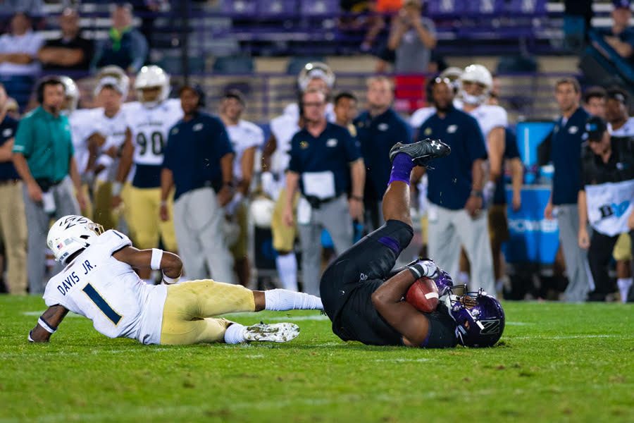 A Northwestern player lies on the ground. The Wildcats were overrun in the second half by Akron en route to a 39-34 defeat on Saturday.