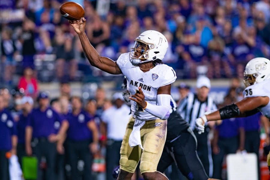 Kato Nelson fires a ball downfield. The Akron quarterback led the Zips to a stunning upset of Northwestern on Saturday.