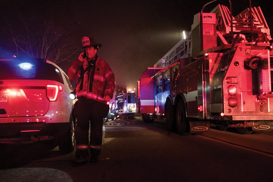 Evanston Fire Chief Brian Scott responds to the scene of a fire that broke out in a garage in the 600 block of Ridge Avenue on February 28, 2018. Scott said closing Station 4 would cause an increase in response times across the city.
