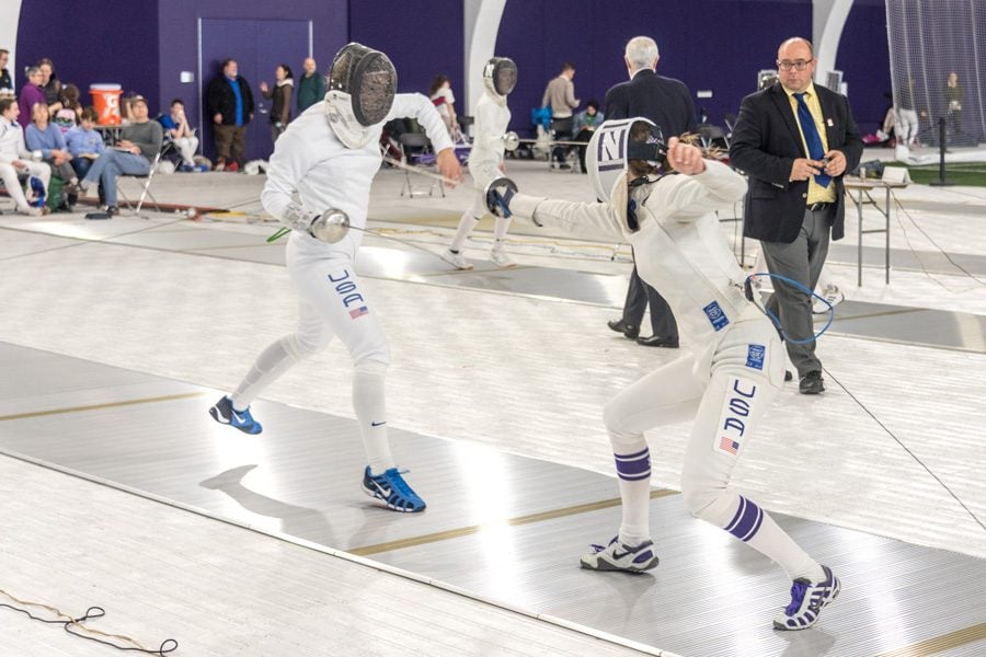 A Northwestern fencer lands a touch. The Wildcats hosted the 2018 Remenyik Open in Ryan Fieldhouse. 