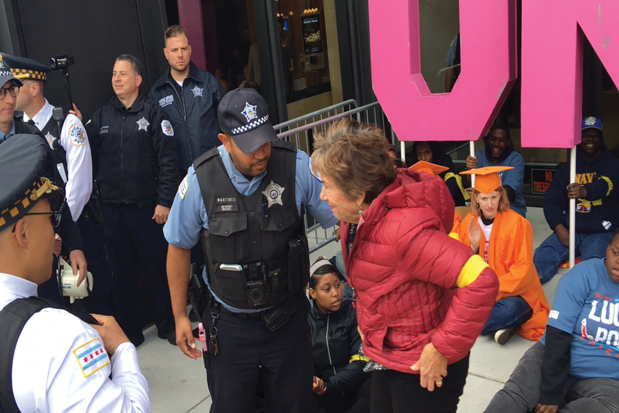 A+police+officer+arrests+U.S.+Rep.+Jan+Schakowsky+%28D-Ill.%29.+The+representative+was+protesting+as+part+of+the+%E2%80%98Fight+for+%2415%E2%80%99+campaign.