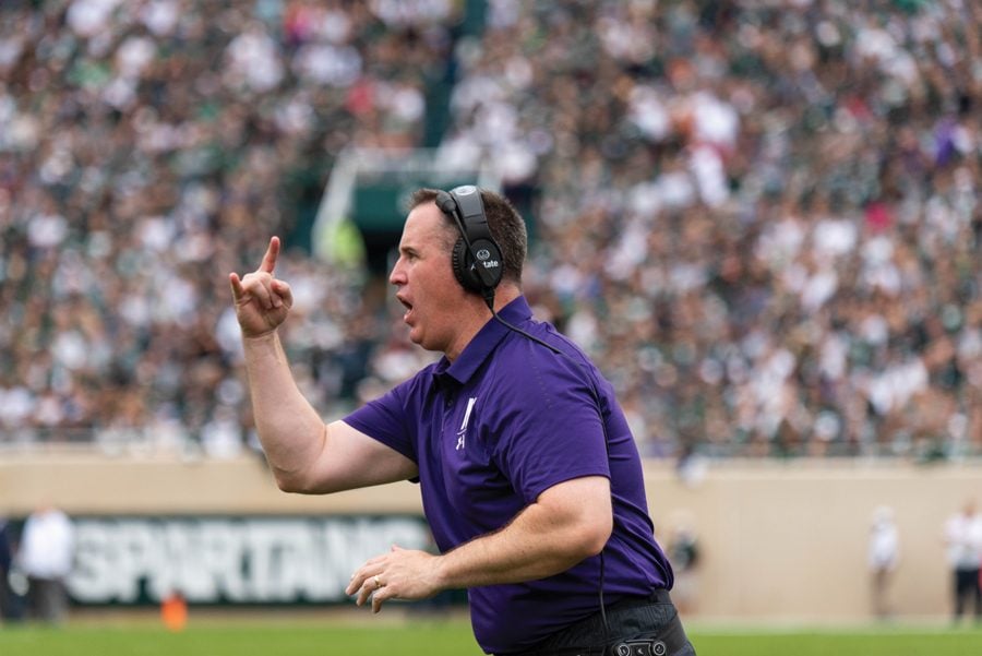 Pat Fitzgerald coaches from the sideline. 