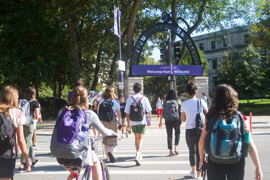 (Allison Ma/The Daily Northwestern) Students walk across Sheridan Road. A 2016 survey conducted by the UCLA Higher Research Education Institute reported that more than 70 percent of college freshman experience some degree of homesickness.