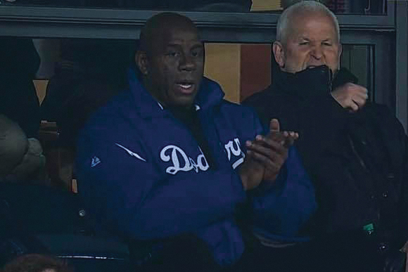 Magic Johnson and Morton Schapiro watch Game 1 of the 2018 World Series. Schapiro was a special guest of Los Angeles Dodgers owner 
