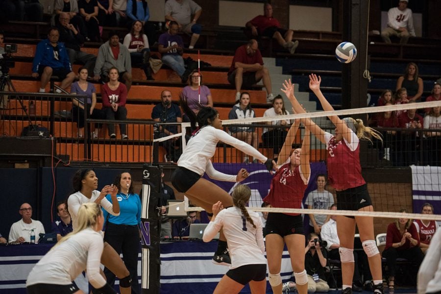 Alana Walker follows through on a kill. The sophomore middle hitter is third on the team in attempts this year.