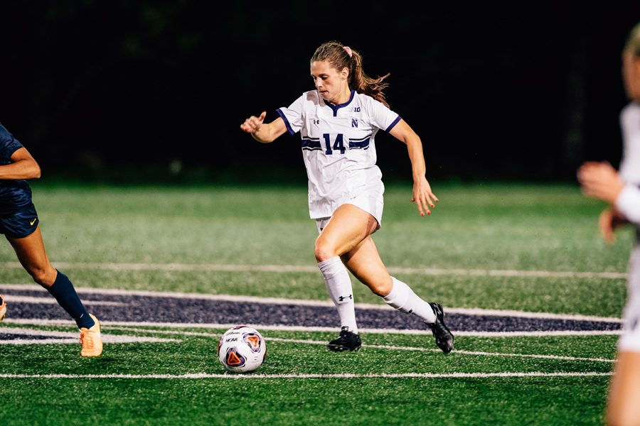Marisa Viggiano dribbles the ball. The senior midfielder scored the equalizer in the 74th minute.