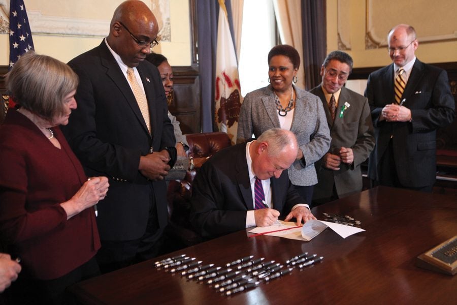 U.S. Sen. Kwame Raoul (D-Ill.) at the 2011 signing of a bill that ended the death penalty in Illinois. Raoul on Tuesday won the race for Illinois attorney general.