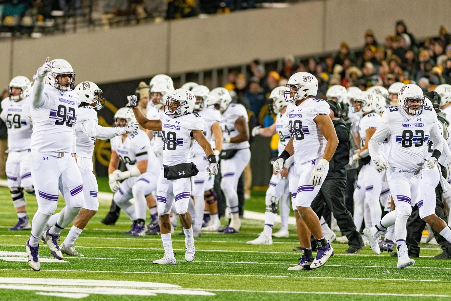 Northwestern+players+celebrate+after+a+touchdown.+The+Wildcats+clinched+the+Big+Ten+West+with+a+win+against+Iowa.