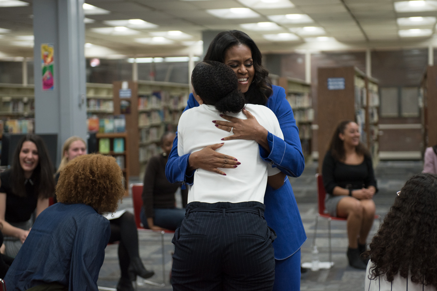 Former+first+lady+Michelle+Obama+hugs+a+student+at+Whitney+Young+Magnet+High+School.+Obama+visited+her+alma+mater+Monday+in+advance+of+her+book+tour.