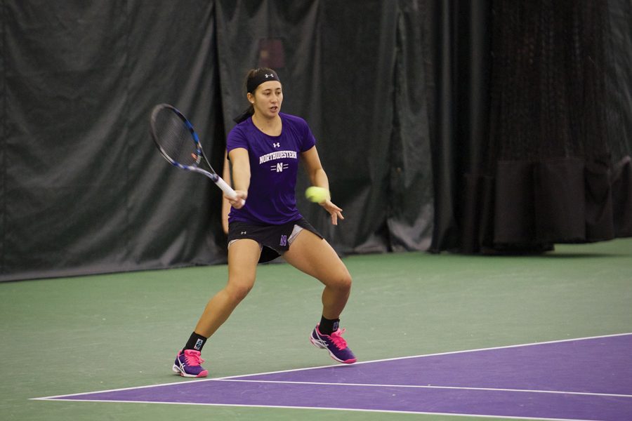 Caroline Pozo prepares to hit the ball. The sophomore won two of her three matches this weekend. 