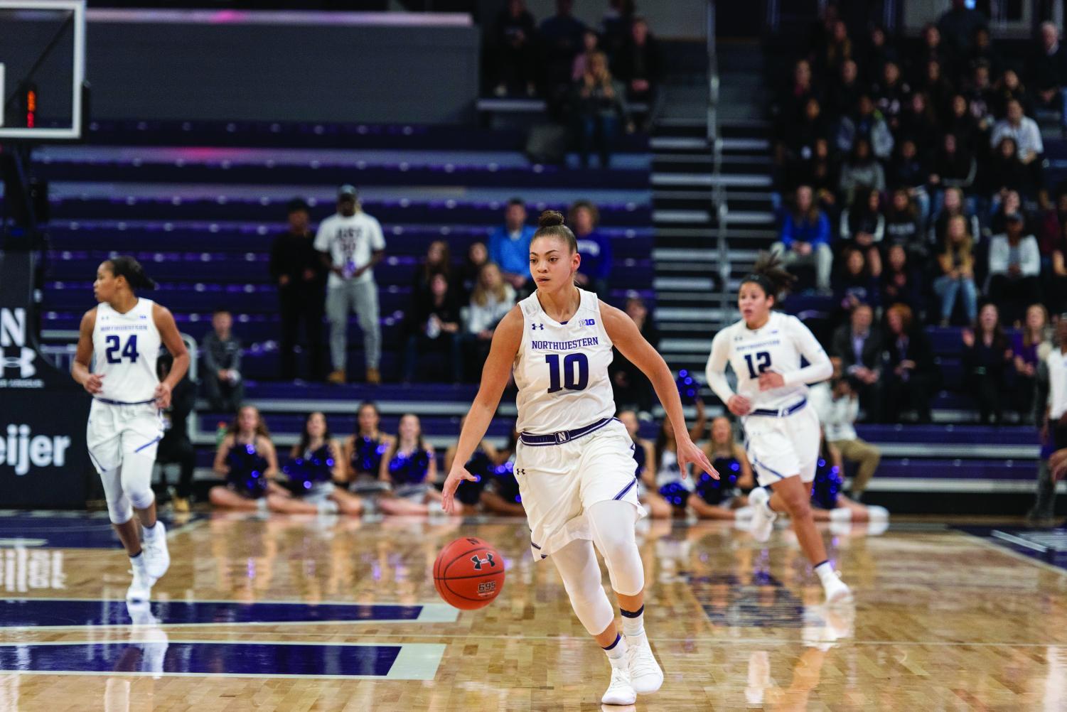 Lindsey+Pulliam+races+down+the+floor.+The+sophomore+guard+was+the+Wildcats%E2%80%99+leading+scorer+in+the+Duel+in+the+Desert.+