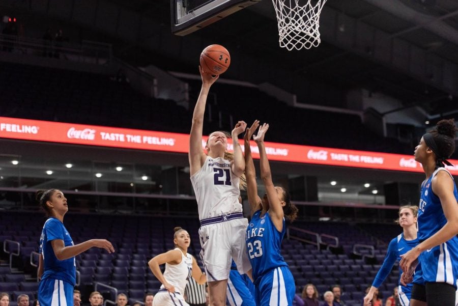 Abbie Wolf shoots a layup. The junior center had 11
points in the Wildcats’ win over Toledo in the second round of the WNIT.