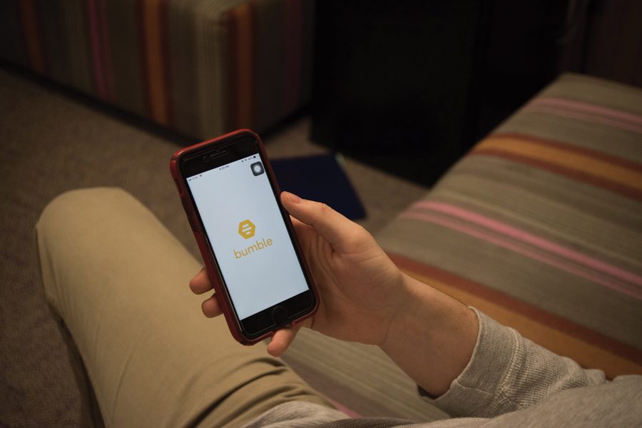 A user opens the app Bumble. Northwestern students have mixed feelings about using the apps. 
