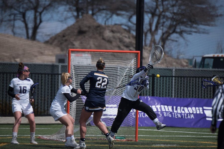 Julie Krupnick deflects a shot. The sophomore will be competing for the starting spot in the net.