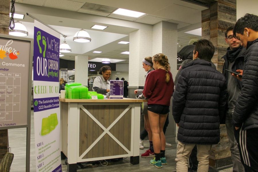 A Compass employee swipes NU students in to Sargent Hall. Northwestern’s chapter of Students Organizing for Labor Rights raised more than $2,500 overnight to pay for ridesharing services for Compass employees in the cold temperatures. 