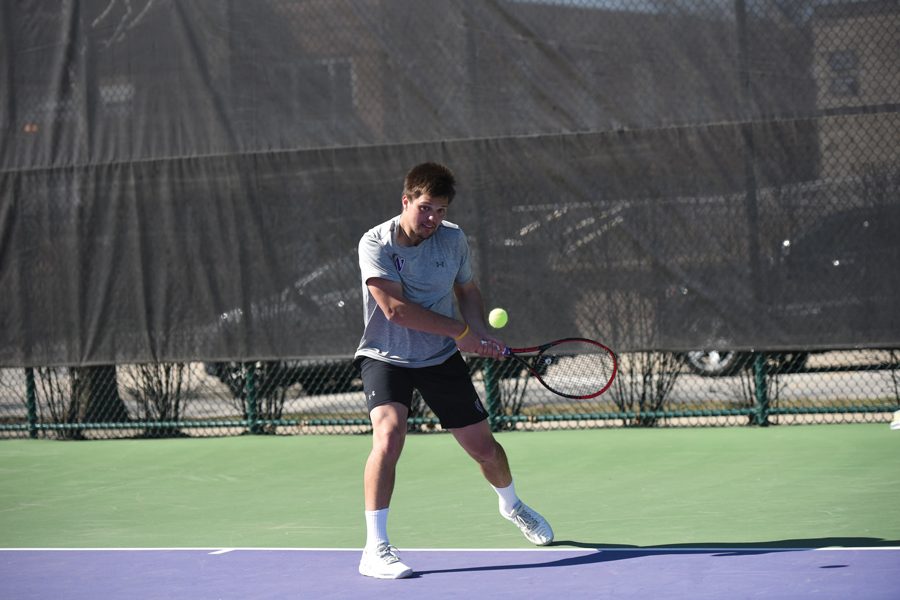 Dominik Stary strikes a backhand. The junior won his singles match 6-3 6-3. 