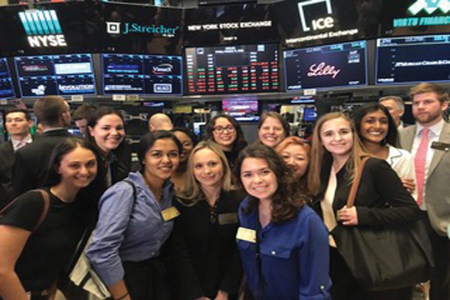 Ambassadors of the Propel Program pose in the New York Stock Exchange during their trip in October. The eight Northwestern students were allowed on the floor for the opening bell, an experience restricted to the public since 9/11. 