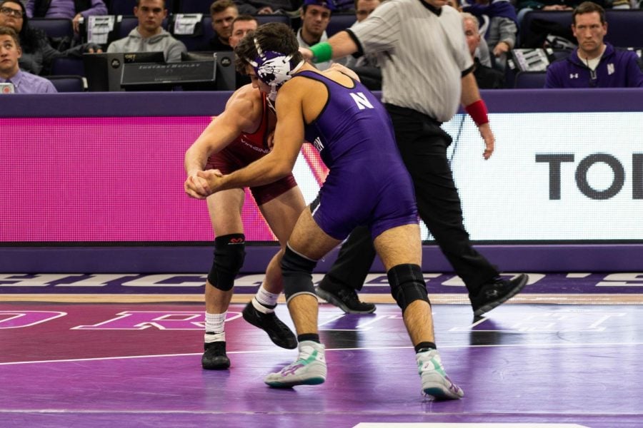 Sebastian Rivera spars with an opponent. The No. 1 ranked sophomore was one of two Northwestern wrestlers to win his bout Friday.