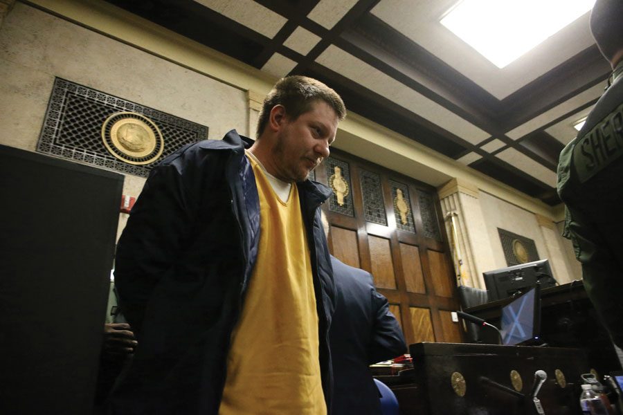 Former Chicago police Officer Jason Van Dyke enters the courtroom to attend a post-conviction hearing at the Leighton Criminal Court Building Friday, Dec. 14, 2018 in Chicago. Van Dyke was sentenced on Friday to just under 7 years in prison for second-degree murder and 16 counts of aggravated battery