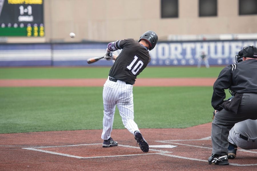 Ben Dickey hits a line drive. The senior scored a run Sunday in a 2-2 weekend for NU.
