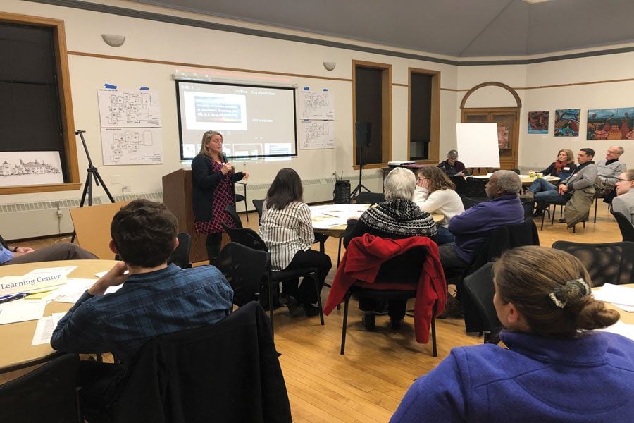 Residents gather in tables at a community meeting hosted by Harley Clarke Community. Evanston residents discussed the future of Harley Clarke Mansion on Thursday.