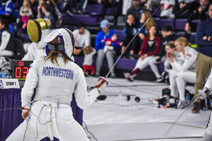 A Northwestern fencer duels an opponent. The Wildcats will participate in the Junior Olympics this weekend.