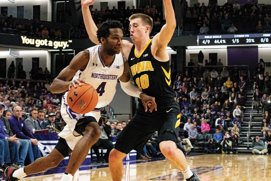 Vic Law dribbles to the basket. The senior forward scored 24 points in Northwestern’s loss.