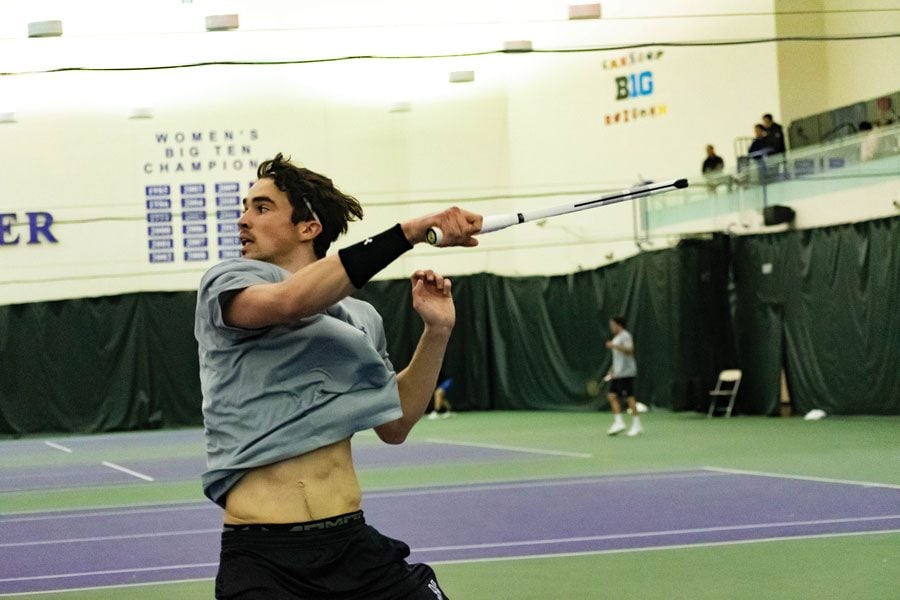 Nick Brookes follows through on a backhand. The sophomore won his doubles match over the weekend