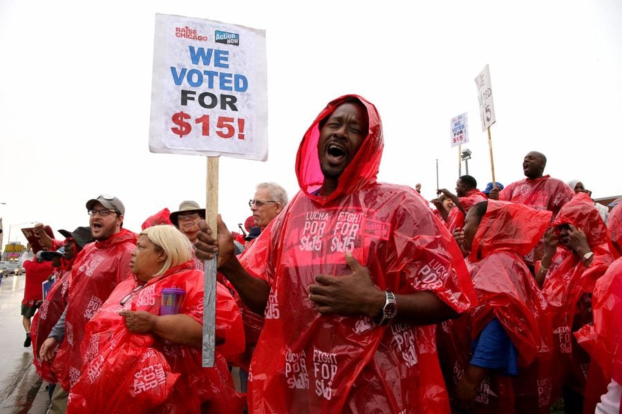 Hundreds of protesters rally for a $15 an hour minimum wage on Sept. 4, 2014 in Chicago. On Tuesday, Gov. J.B. Pritzker signed a bill to increase the minimum wage in Illinois to $15 by 2025.