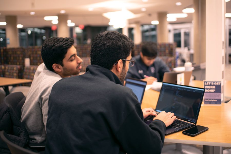 Students work at computers in the library. During the time that NUDM participants are dancing this weekend, some will be hanging out with their friends or studying for finals instead