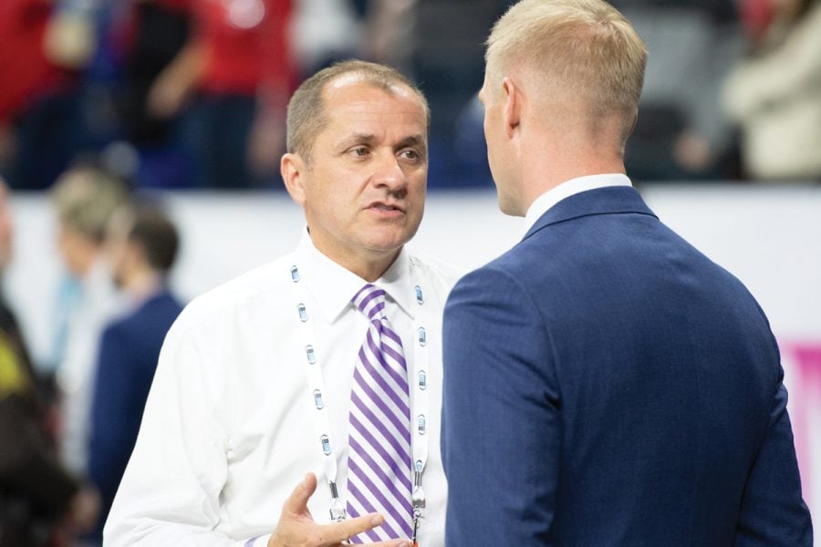 Jim Phillips networks at the Big Ten Championship Game. Northwestern’s Athletic Director helped lead the program to the win the Big Ten west this season.