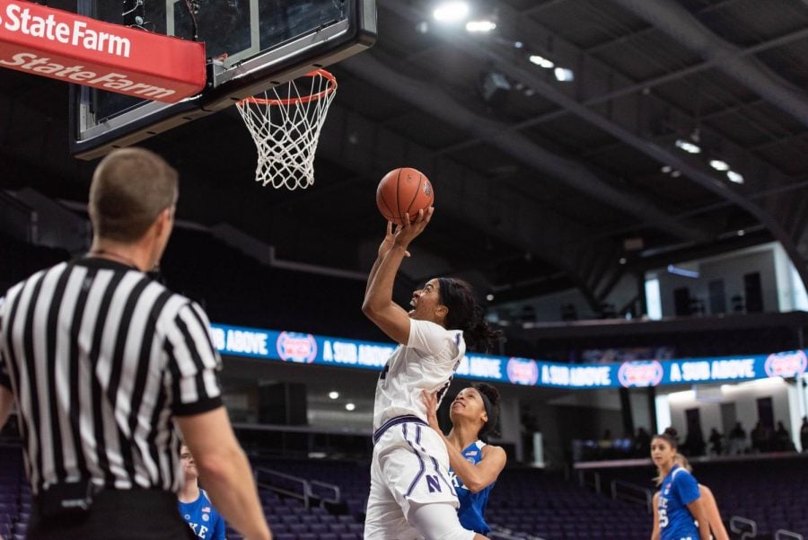 Pallas Kunaiyi-Akpanah puts a shot back up. The
senior forward was dominant in the first round of the WNIT.