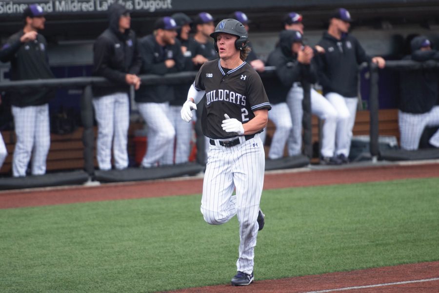 Jack Dunn runs into home plate. The senior shortstop had seven hits over the weekend.