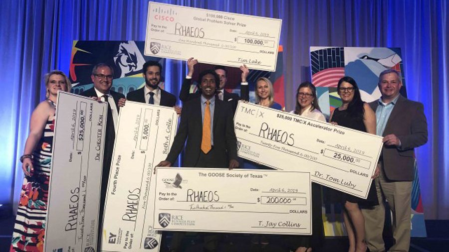 The Rhaeos team poses with their winnings at the Rice Business Plan Competition. The company, founded by engineering prof. John Rogers, makes medical devices for patients with hydrocephalus.