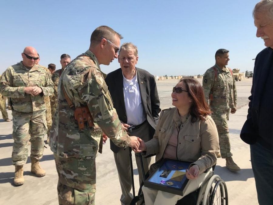 U.S. Sens. Tammy Duckworth (D-Ill.), Johnny Isakson (R-Ga.) and Angus King (I-Maine) meet with troops in Iraq. Duckworth led a bipartisan congressional delegation on a trip to the country last week.