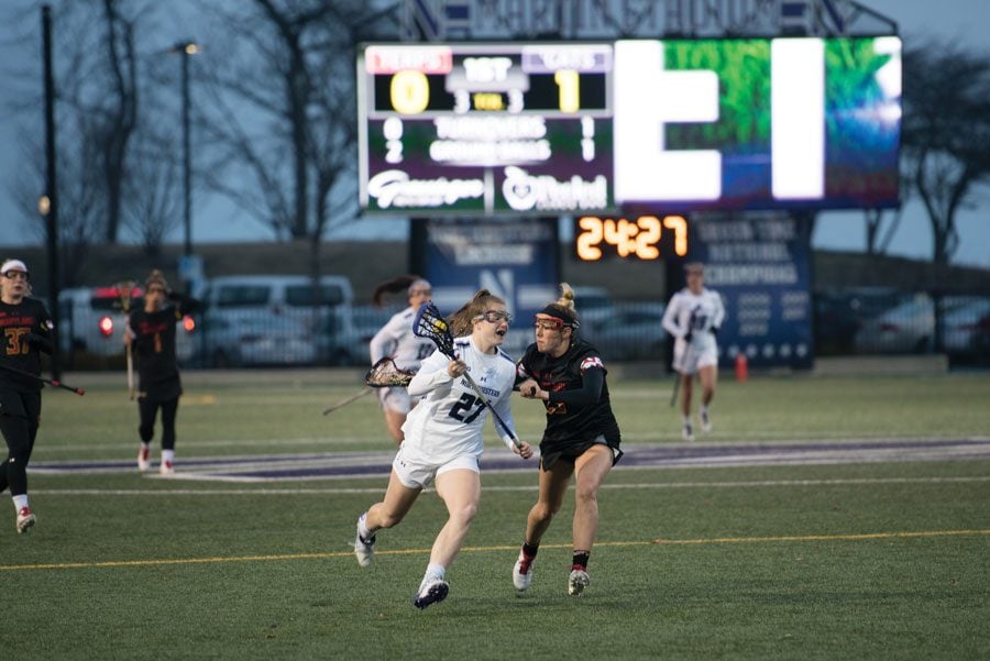 Izzy Scane drives the ball down the field. The freshman scored three goals in NU’s 17-13 loss to Maryland.