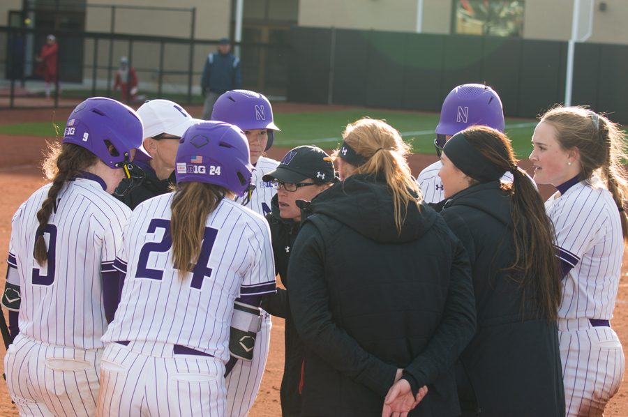 The Cats listen as Caryl Drohan gives instructions. NU will play its final two home games of the regular season Tuesday.