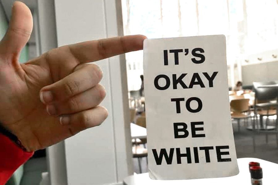 A sticker found in Allison Dining Hall with the words “It’s okay to be white.” University Police are looking into the incident.