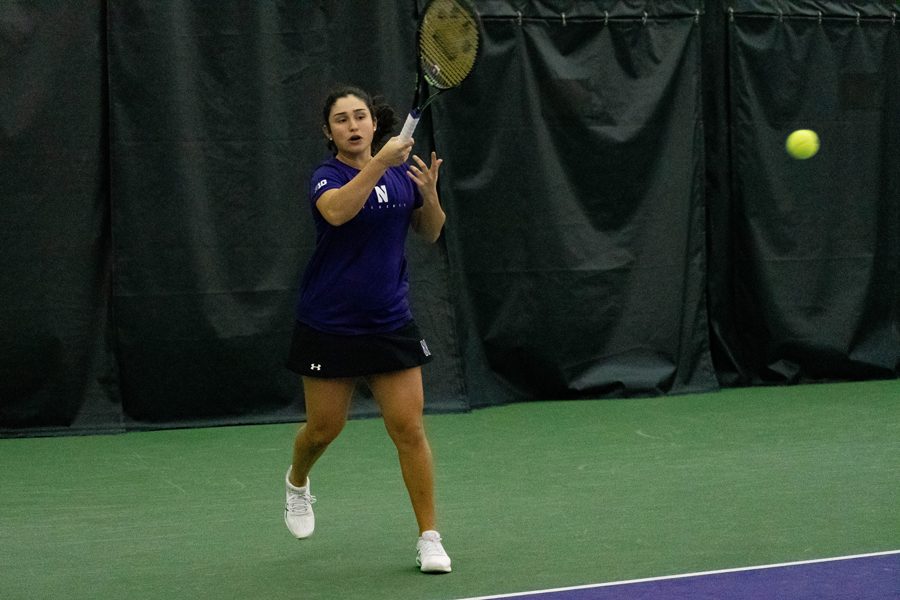 Inci Ogut hits the ball. The sophomore and the Wildcats open Big Ten Tournament play against Ohio State on Friday.
