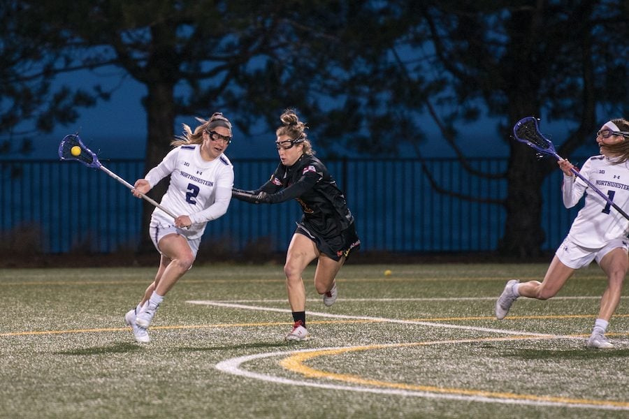Selena Lasota maneuvers around a defender. The senior was named a finalist for lacrosse’s most prestigious award last week.