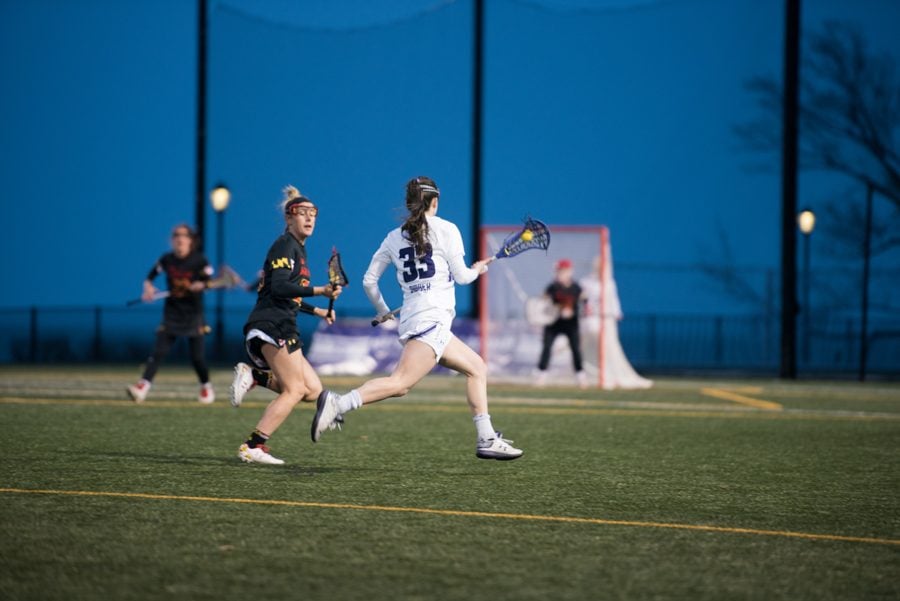 Brennan Dwyer runs down the field against Maryland in April. The Wildcats will face the Terrapins for the third time this year on Friday in the Final Four.