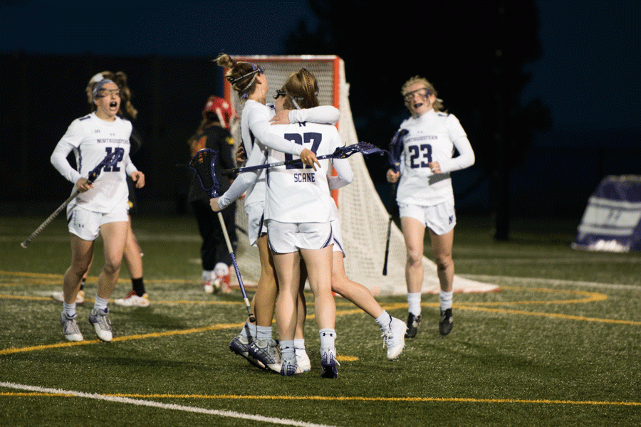 Freshman Izzy Scane celebrates with teammates after a goal. The Wildcats took home three end-of-year Big Ten individual awards Monday.