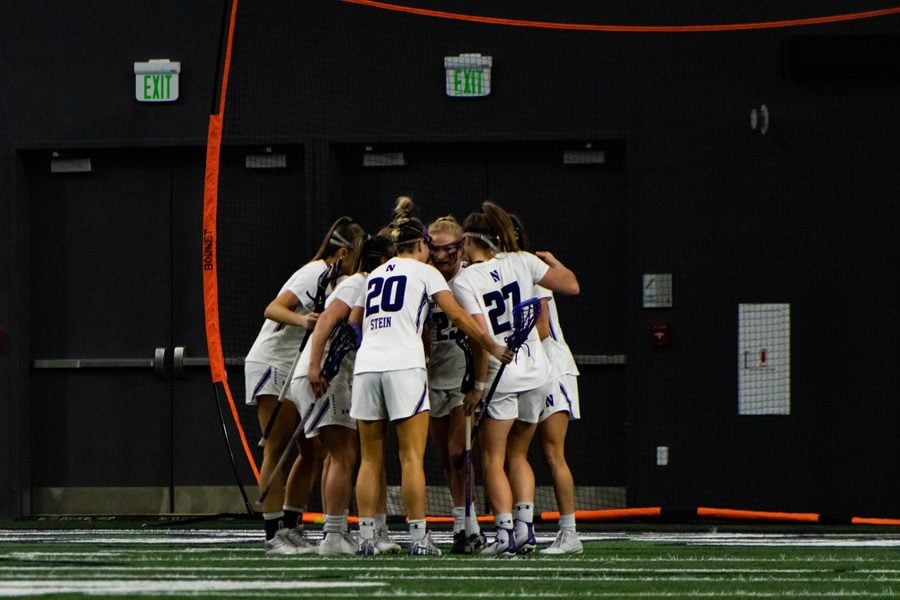 The Wildcats talk after a goal. NU will begin its 2019 NCAA Tournament run this Sunday at home.