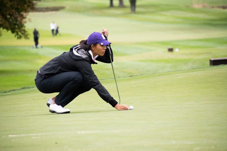 Kelly Su lines up a put. The freshman is one of five golfers who will represent the Wildcats in this weekend’s NCAA Championships.