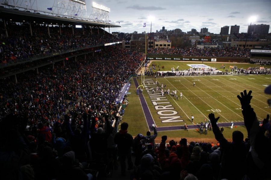Northwestern+fans+celebrate+a+touchdown+against+Illinois+in+a+2010+game+at+Wrigley+Field.+The+Cats+will+play+at+Wrigley+Field+four+times+in+the+next+ten+years%2C+coach+Pat+Fitzgerald+said+on+a+podcast.